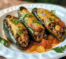 Un plato con Chiles Rellenos de Picadillo, si deseas una receta saludable y facil de hacer, receta de Chef Goya.